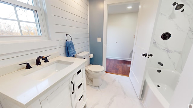 full bathroom with vanity, tub / shower combination, wooden walls, and toilet