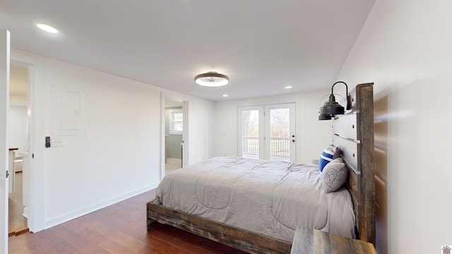 bedroom featuring access to exterior and dark hardwood / wood-style floors