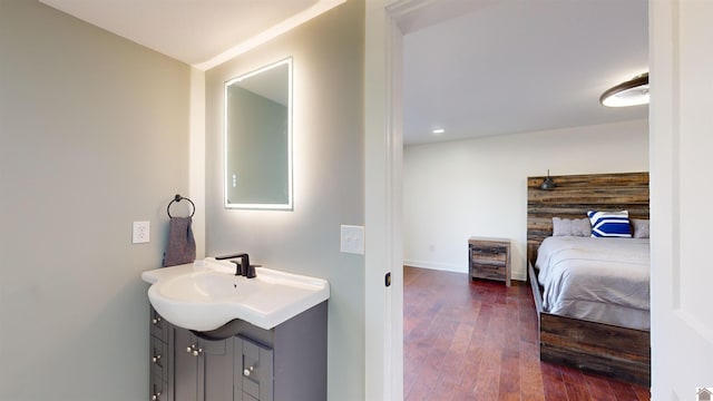 bathroom with vanity and hardwood / wood-style floors