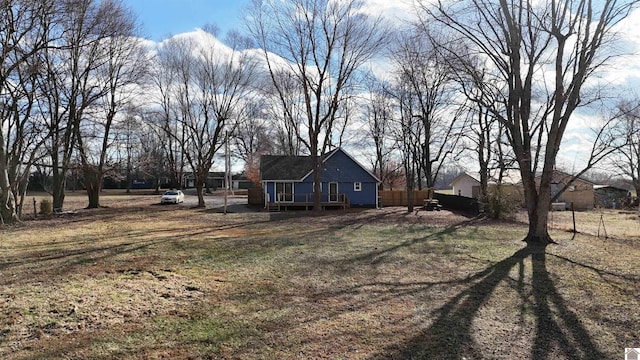 view of yard with a wooden deck