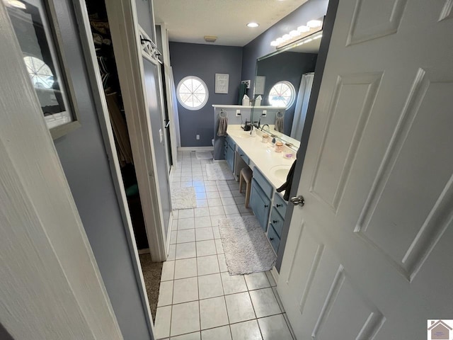 bathroom featuring tile patterned floors and vanity