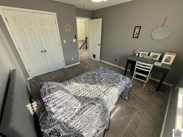 carpeted bedroom featuring a closet