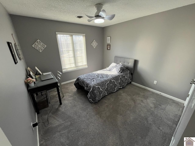 carpeted bedroom with a textured ceiling and ceiling fan