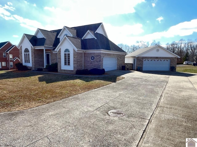 view of front of property with a garage and a front yard