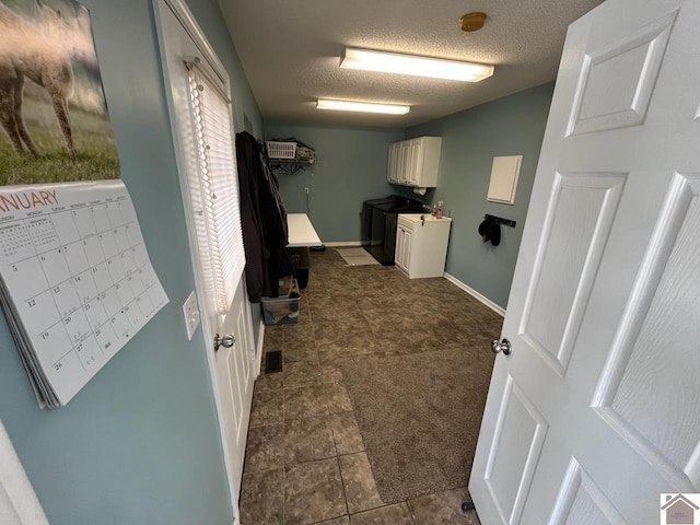 laundry area featuring washer / clothes dryer, mail boxes, and a textured ceiling