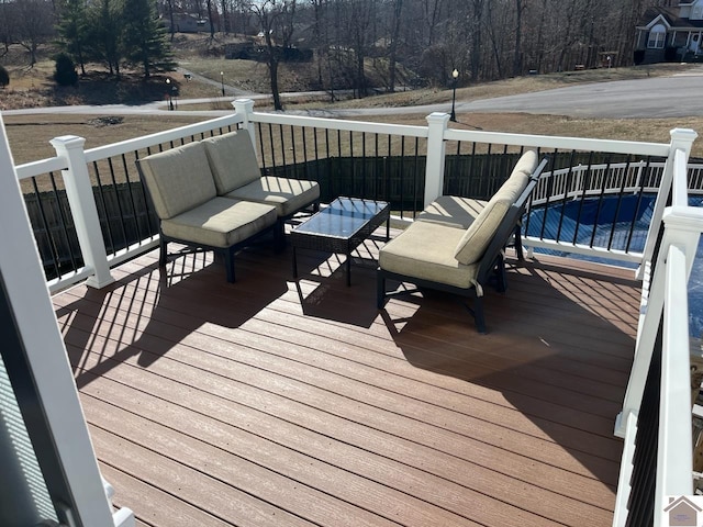 wooden deck featuring an outdoor living space