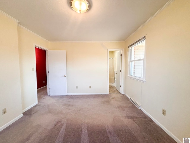 unfurnished bedroom featuring ornamental molding and carpet