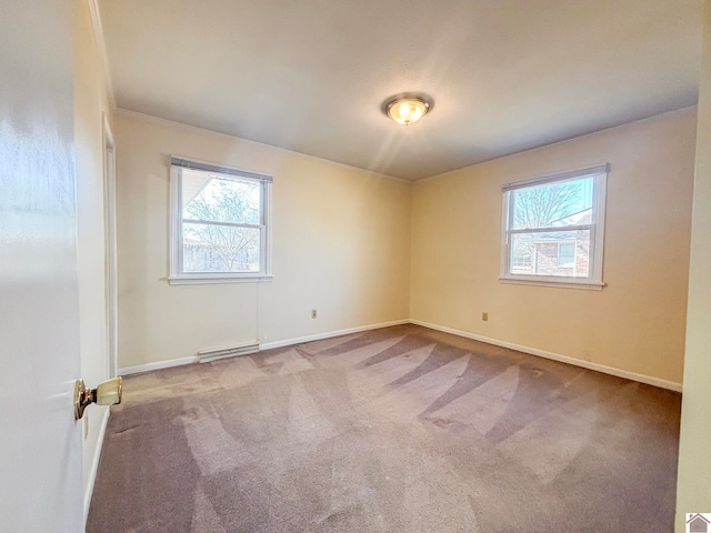 unfurnished room with light colored carpet