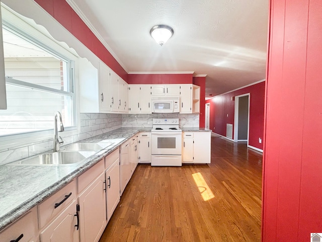 kitchen featuring sink, white cabinets, white appliances, and light wood-type flooring