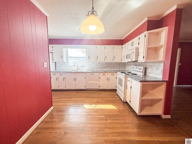 kitchen with sink, white appliances, light hardwood / wood-style flooring, white cabinetry, and tasteful backsplash