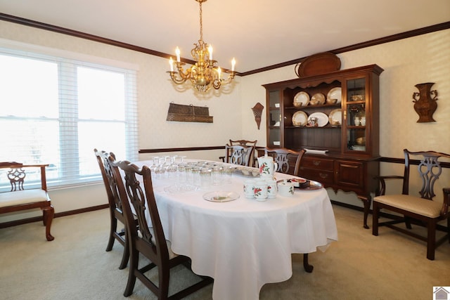 dining area featuring a notable chandelier, ornamental molding, and light colored carpet