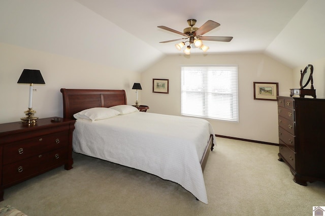 bedroom with ceiling fan, lofted ceiling, and light colored carpet