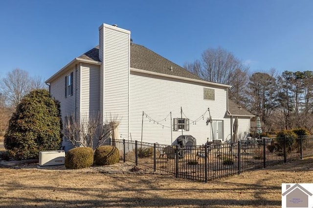 view of property exterior with a yard