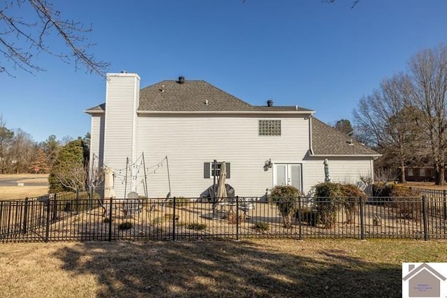 rear view of house with a lawn