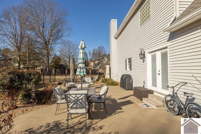 view of patio with french doors and a grill