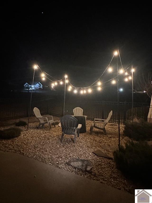 patio at night with an outdoor fire pit