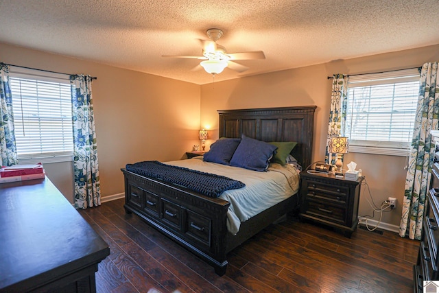 bedroom with a textured ceiling, baseboards, a ceiling fan, and hardwood / wood-style floors