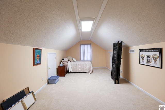 carpeted bedroom with lofted ceiling and a textured ceiling