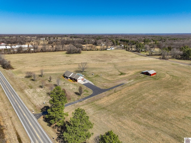 birds eye view of property featuring a rural view