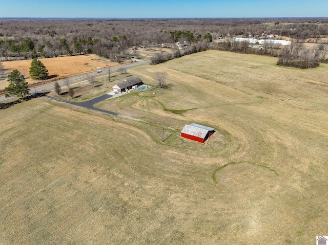 birds eye view of property with a rural view