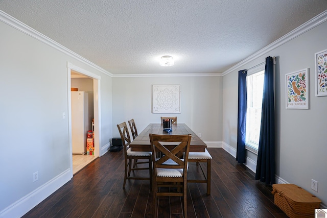 dining area with ornamental molding, dark wood-type flooring, and a textured ceiling