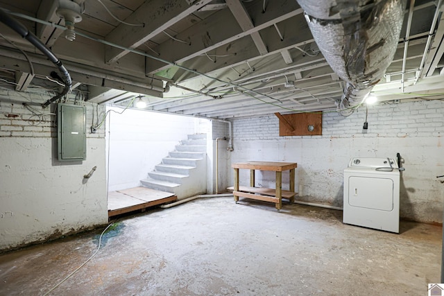 basement with washer / clothes dryer and electric panel