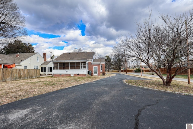 view of front of house with a sunroom