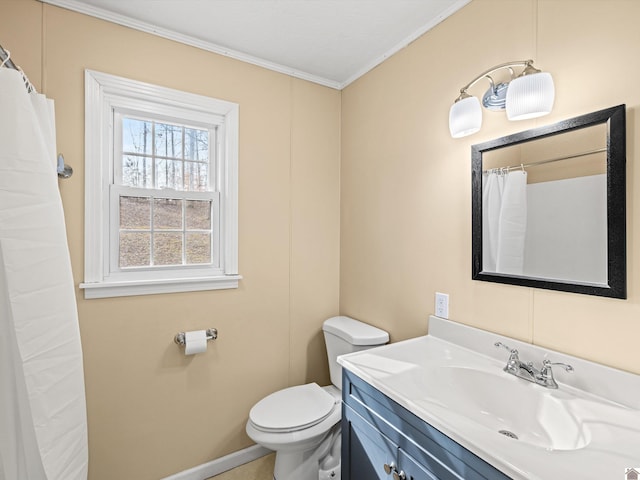 bathroom featuring vanity, crown molding, and toilet