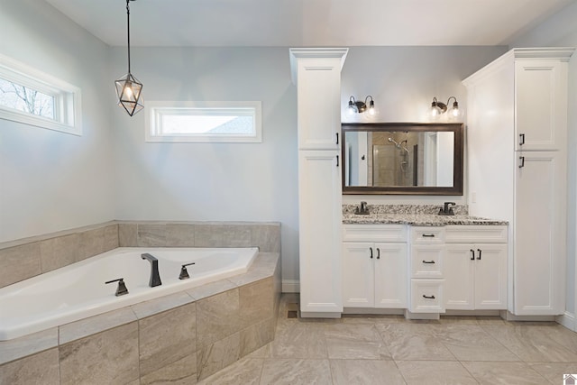 bathroom featuring vanity and plus walk in shower