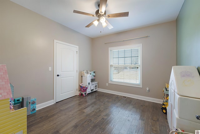 rec room featuring dark hardwood / wood-style floors and ceiling fan