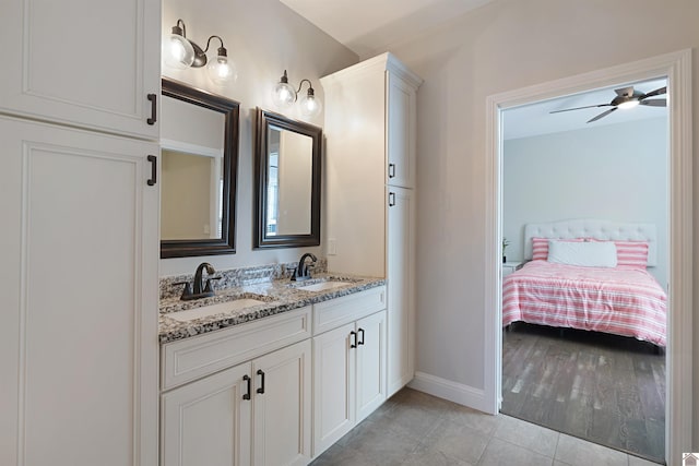 bathroom featuring tile patterned flooring, vanity, and ceiling fan