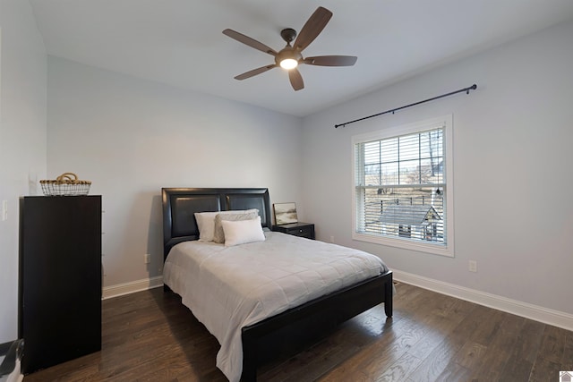 bedroom with dark hardwood / wood-style floors and ceiling fan