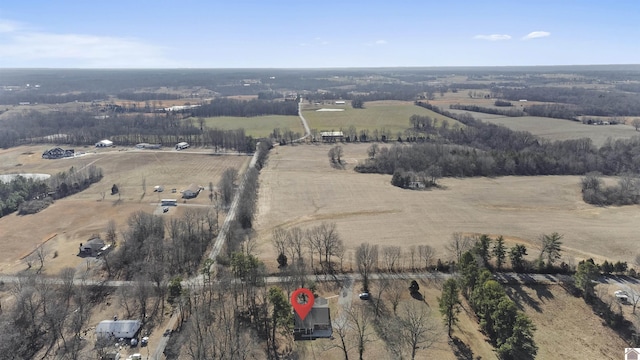 birds eye view of property with a rural view