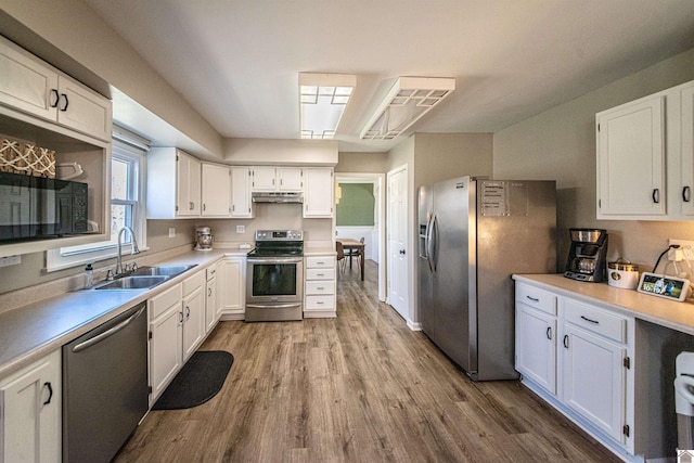 kitchen featuring white cabinetry, stainless steel appliances, and sink