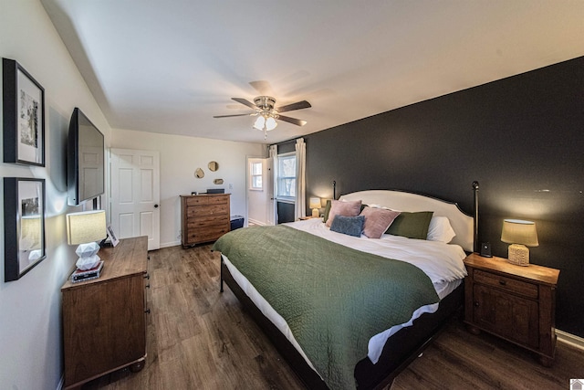 bedroom featuring ceiling fan and dark hardwood / wood-style floors