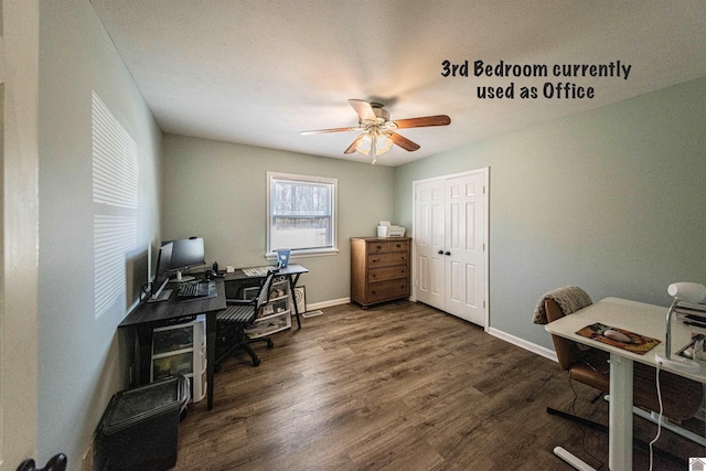 office with dark hardwood / wood-style floors and ceiling fan