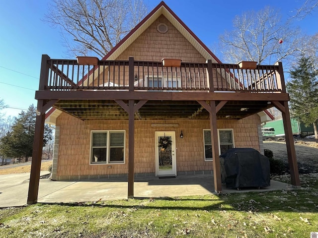 back of house featuring a patio and a deck