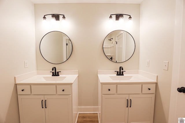 bathroom featuring vanity and hardwood / wood-style flooring