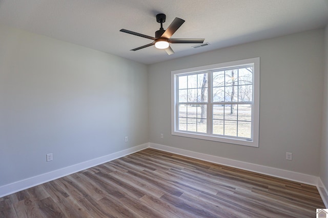 spare room featuring ceiling fan and wood-type flooring