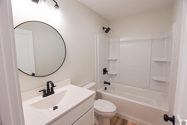 full bathroom featuring wood-type flooring, vanity, shower / bathtub combination, and toilet