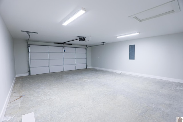 garage with a garage door opener and electric panel