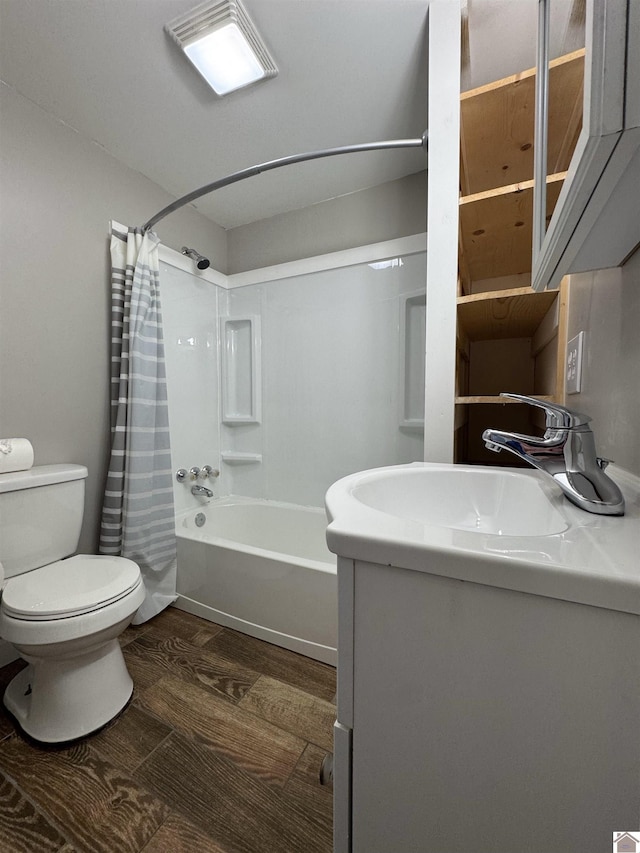 full bathroom featuring sink, hardwood / wood-style floors, shower / bath combination with curtain, and toilet