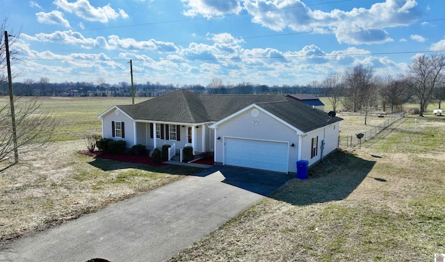 single story home featuring a garage, a front yard, and covered porch