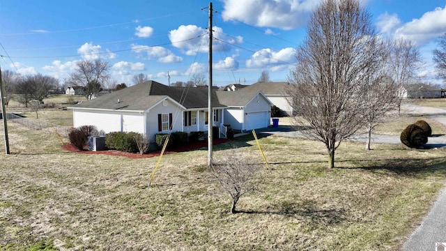 view of front facade with a garage and a front lawn