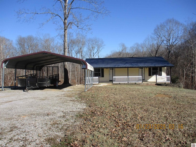 view of front of home with a carport and covered porch