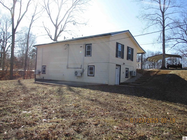 rear view of house featuring a carport