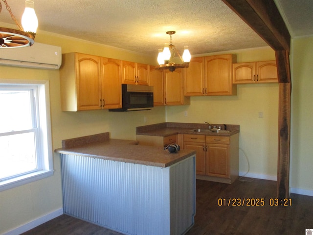 kitchen with sink, an inviting chandelier, dark hardwood / wood-style floors, a healthy amount of sunlight, and decorative light fixtures