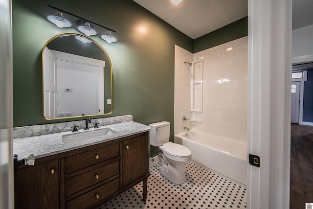 full bathroom with bathing tub / shower combination, vanity, tile patterned floors, and toilet