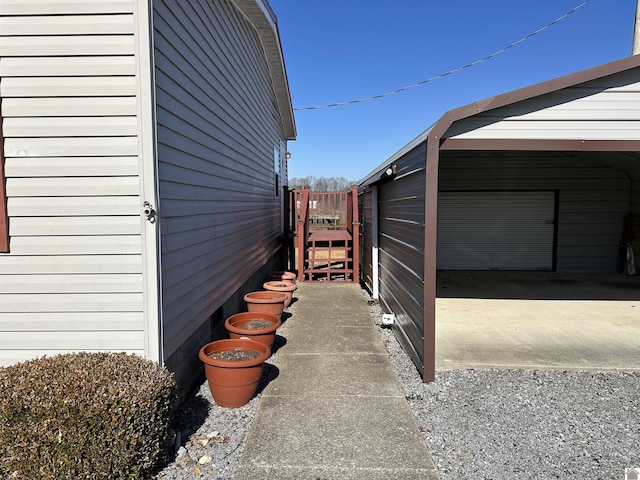 view of side of home with a carport