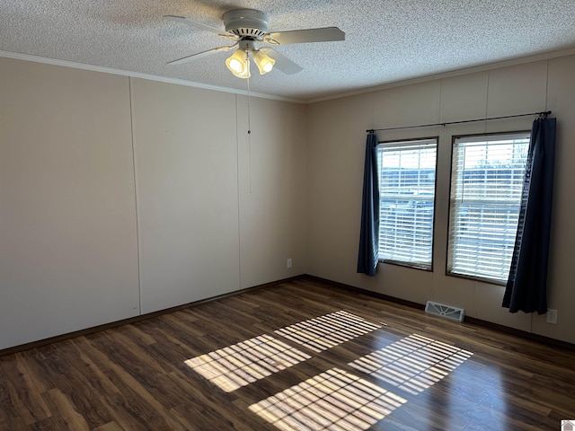 unfurnished room featuring crown molding, dark hardwood / wood-style floors, ceiling fan, and a textured ceiling